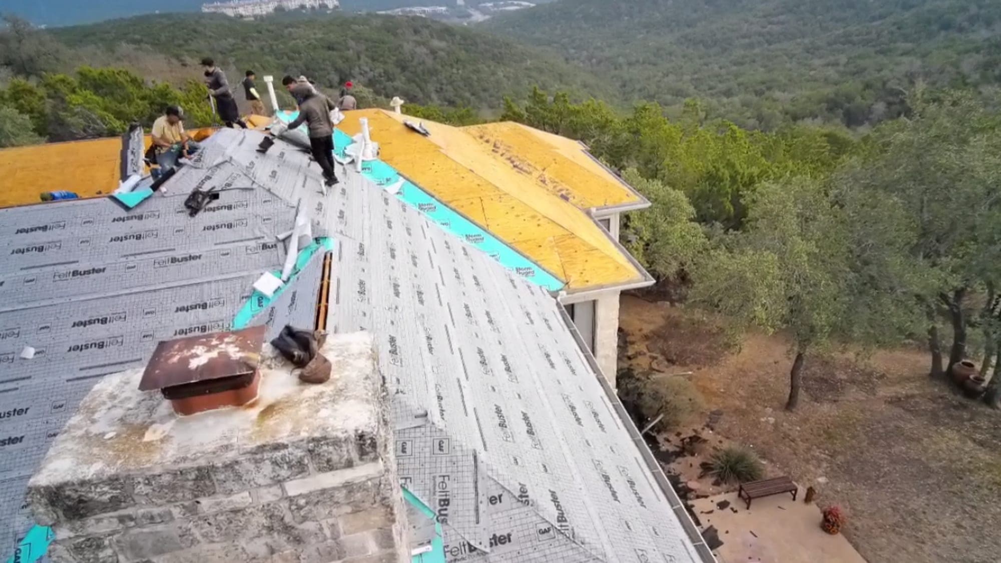 Aerial view of a large home fully dried in with synthetic underlayment