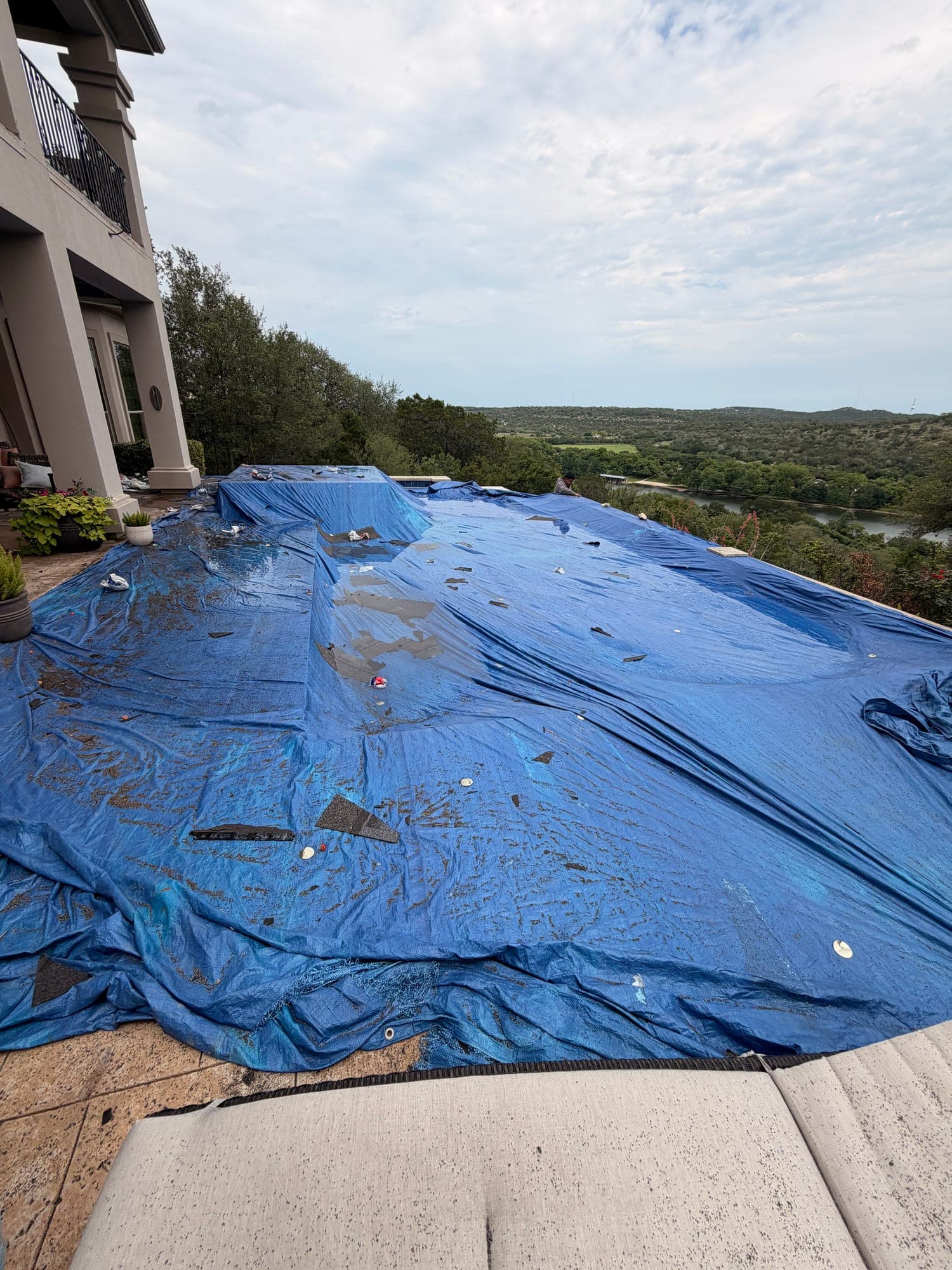 Pool and patio fully tarped before roof tear-off
